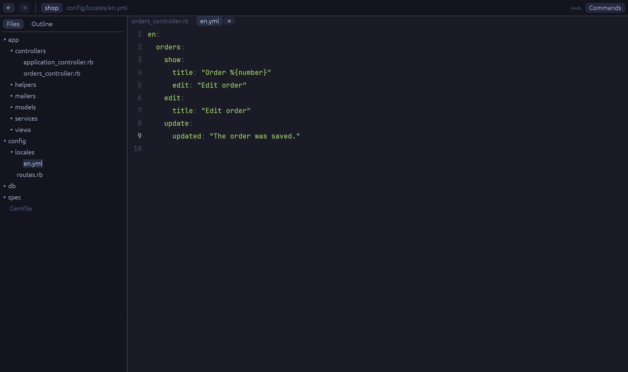 Rubyscope after the click: config/locales/en.yml is open at updated.